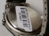 a watch that is sitting on a table with a barcode on it