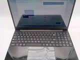 a laptop computer with a keyboard on a white surface