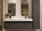 a bathroom with two sinks and a mirror on the wall