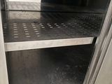 a stainless steel open door to a stainless steel oven
