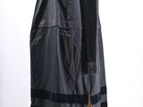 an image of a mannequin dressed in a black coat and scarf