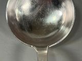 a spoon that is sitting on a table