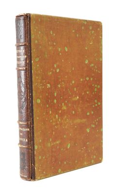 an old book sitting on top of a white surface next to a white background