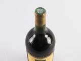 a bottle of wine that is sitting on a table