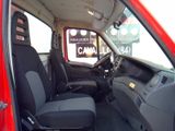 a red truck with black seats in the back of it