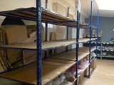 a room with a lot of boxes and boxes on the shelves