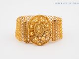 an image of a gold bracelet on a white background