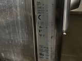 a stainless steel oven that has a door open