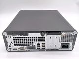 the back view of a computer with a hard drive on top of it
