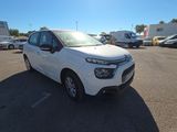 the white citrole is parked in a parking lot