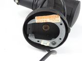 a close up of a black electrical device on a white surface