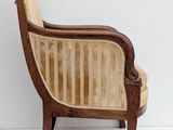 an image of a wooden chair with a striped seat
