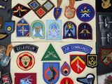 a lot of military patches on a table