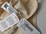 a label on the back of a underwear that is attached to a bra