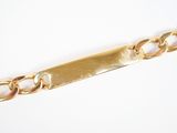 une image représentant un bracelet en or orné d'une barre