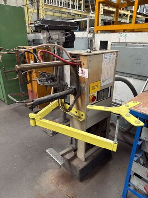 a machine that is sitting on a table in a factory