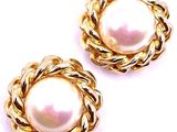 two pairs of gold tone earrings with a white pearl in the center