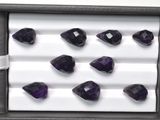 several amethorate gems are displayed in a display case