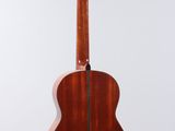 a close up of an acoustic guitar on a white background