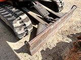 an image of a close up of a bulldozer in the dirt