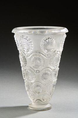a glass vase that is sitting on a table