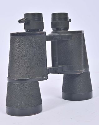 two black binoculars that are sitting on a white surface