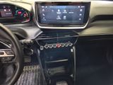 the interior of a car with a steering wheel, dashboard, and display screen