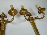 pair of antique brass wall sconces with two candles