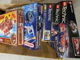 a lot of legos in a box on the floor