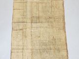 an old piece of paper that is sitting on top of a table