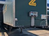 a truck that is parked in front of a building