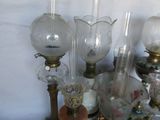 a lot of glass vases sitting on a table