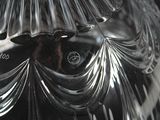a close up of a glass vase on a table
