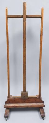 an image of a wooden easer with a wooden handle on a white background