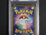 a close up of a pokemon card in a plastic case