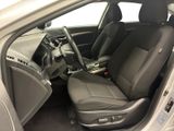 the interior of a car with the door open showing the driver ' s seat area