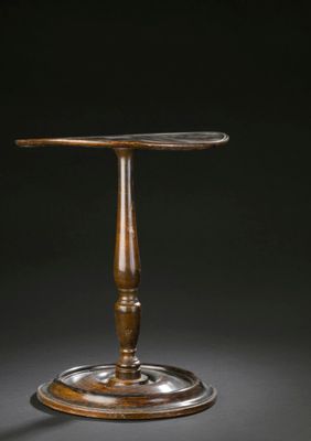 side table in the manner of person