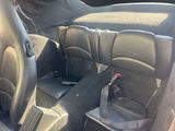 a picture of the inside of a car with the seats down