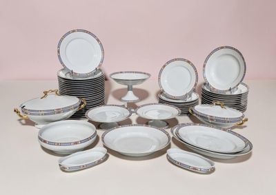 a lot of plates and bowls that are on the table