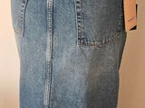denim skirt with pockets on a mannequin torso