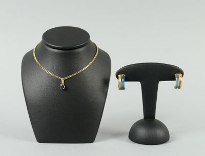 a black mannequin with a necklace and earrings on it