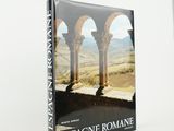 the front cover of a book with an image of a man sitting on a stone wall