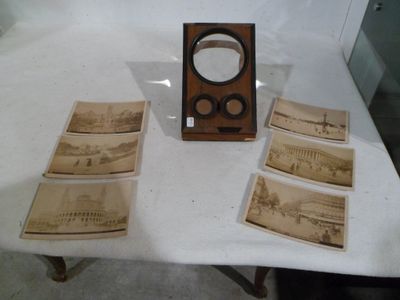 a table with a bunch of old photos on it
