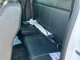 a seat in the back of a car with a box of items in it