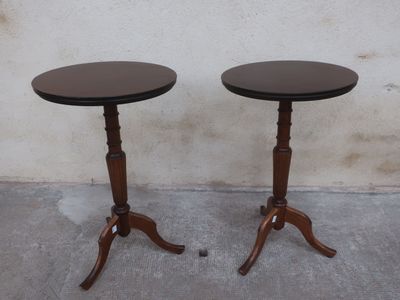 two tables that are sitting on the concrete floor