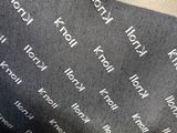 a black and white picture of a bag with words on it