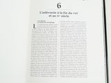 an open book with a picture of a cat on it