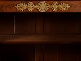 a wooden cabinet with a mirror on top of it