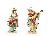 paire de figurines chinoises représentant un homme et une femme jouant d'instruments de musique