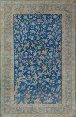 a blue rug with a floral design on it